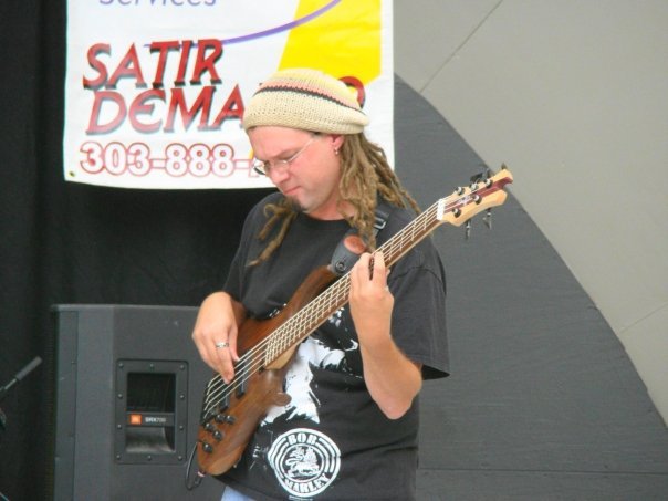 Tim Carmichael playing his Tobias Killer B electric bass at Rhythm on the River in Longmont
