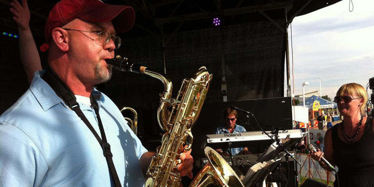 Doug Carmichael plays baritone saxophone at Longmont, Colorado's Rhythm on the River