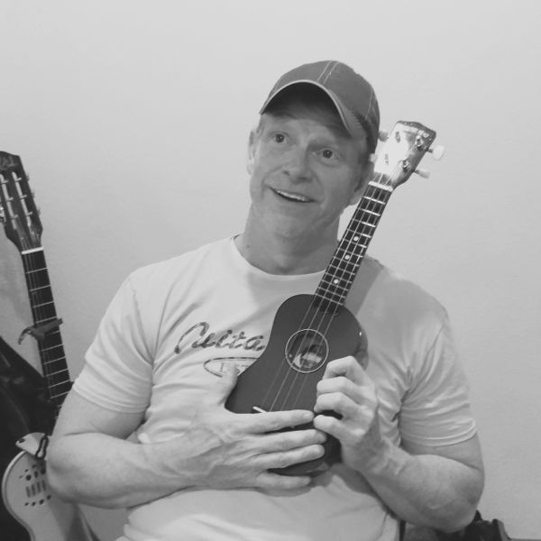 Richard Ellis looking wistful with his ukulele.