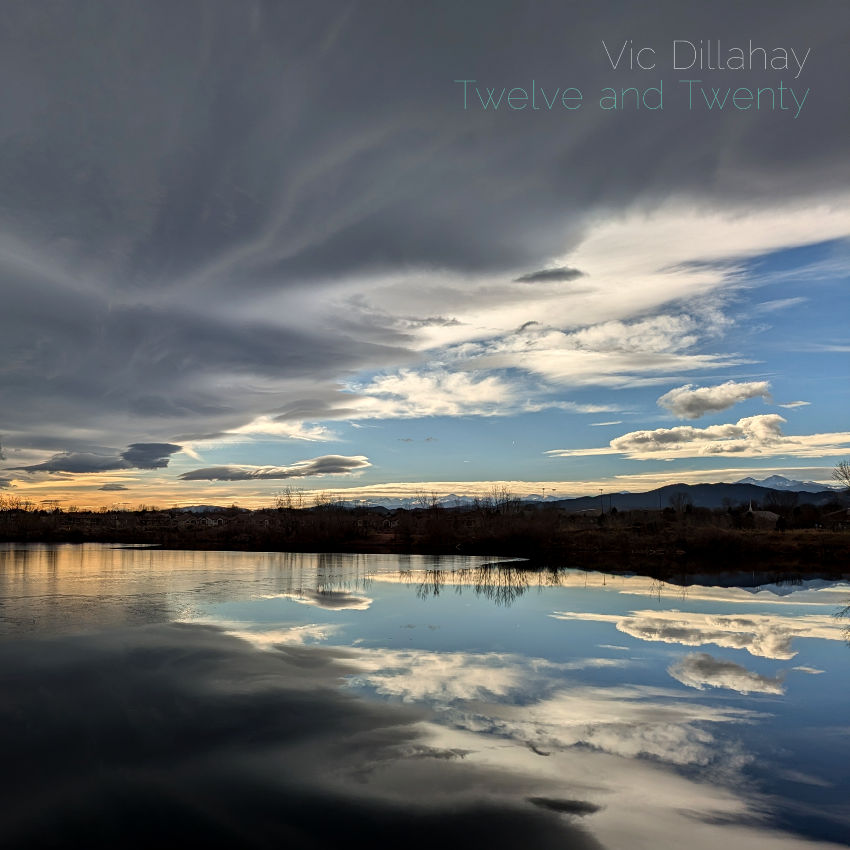 Twelve and Twenty album cover. Twelve and Twenty album cover. The sun is starting to set over a partially frozen lake. The mountains in the background and storm clouds overhead are reflected in its surface.